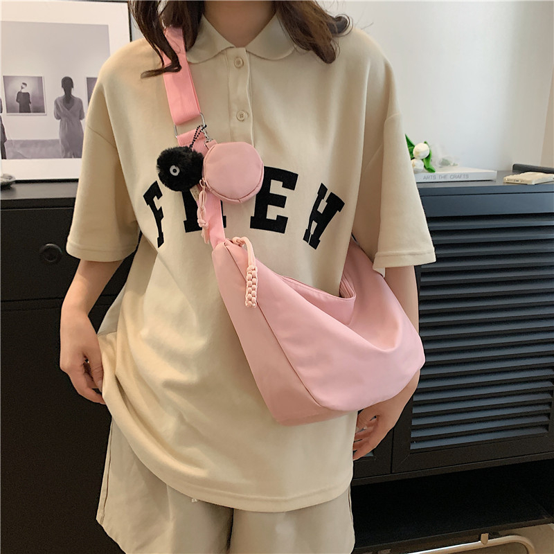 日系夏季斜挎帆布包女新款休闲轻便小挎包软妹学生百搭饺子单肩包